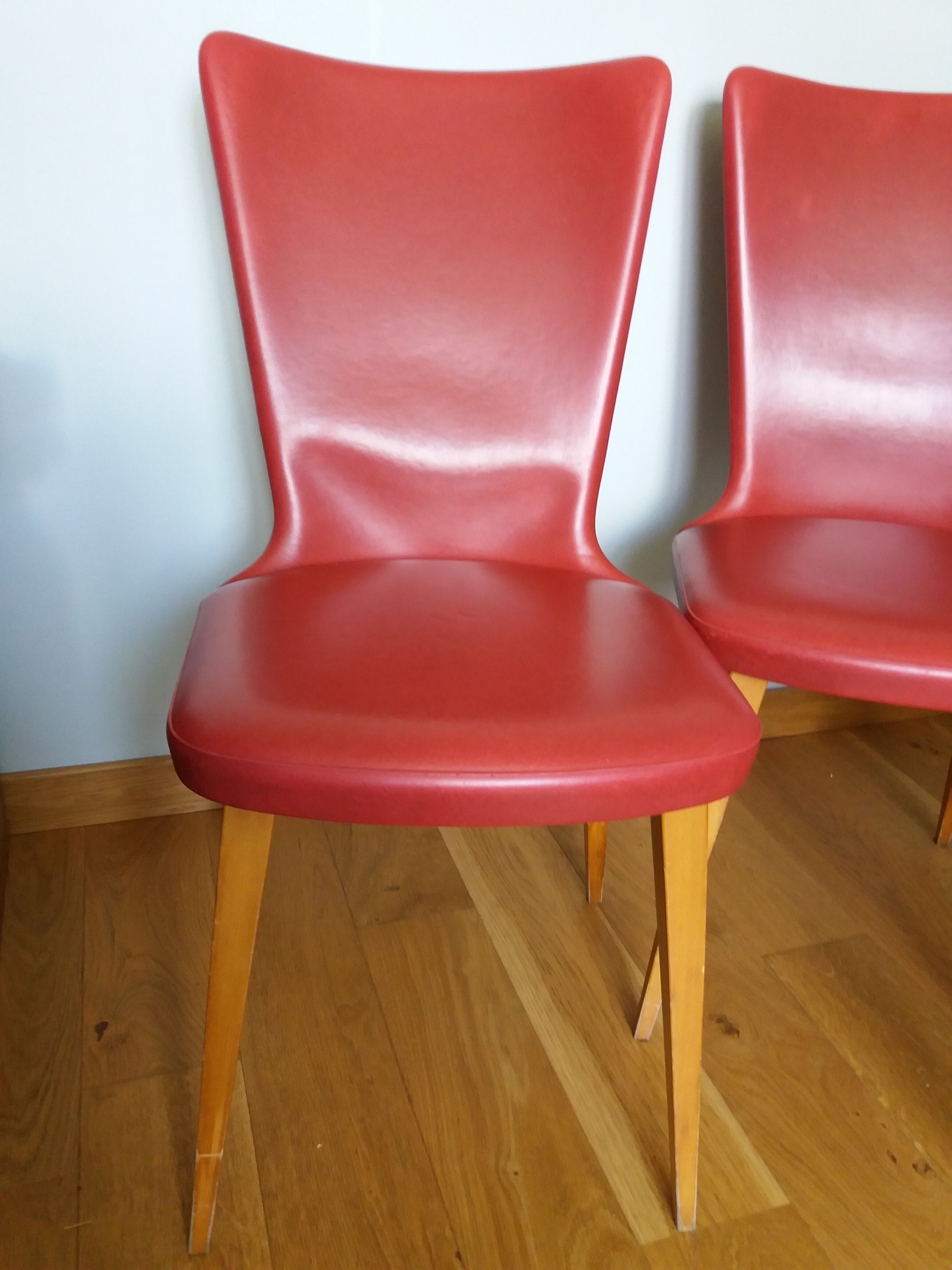 Baumann skai red imitation leather chairs from the 1950s