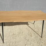 Violin-shaped coffee table with brass legs
