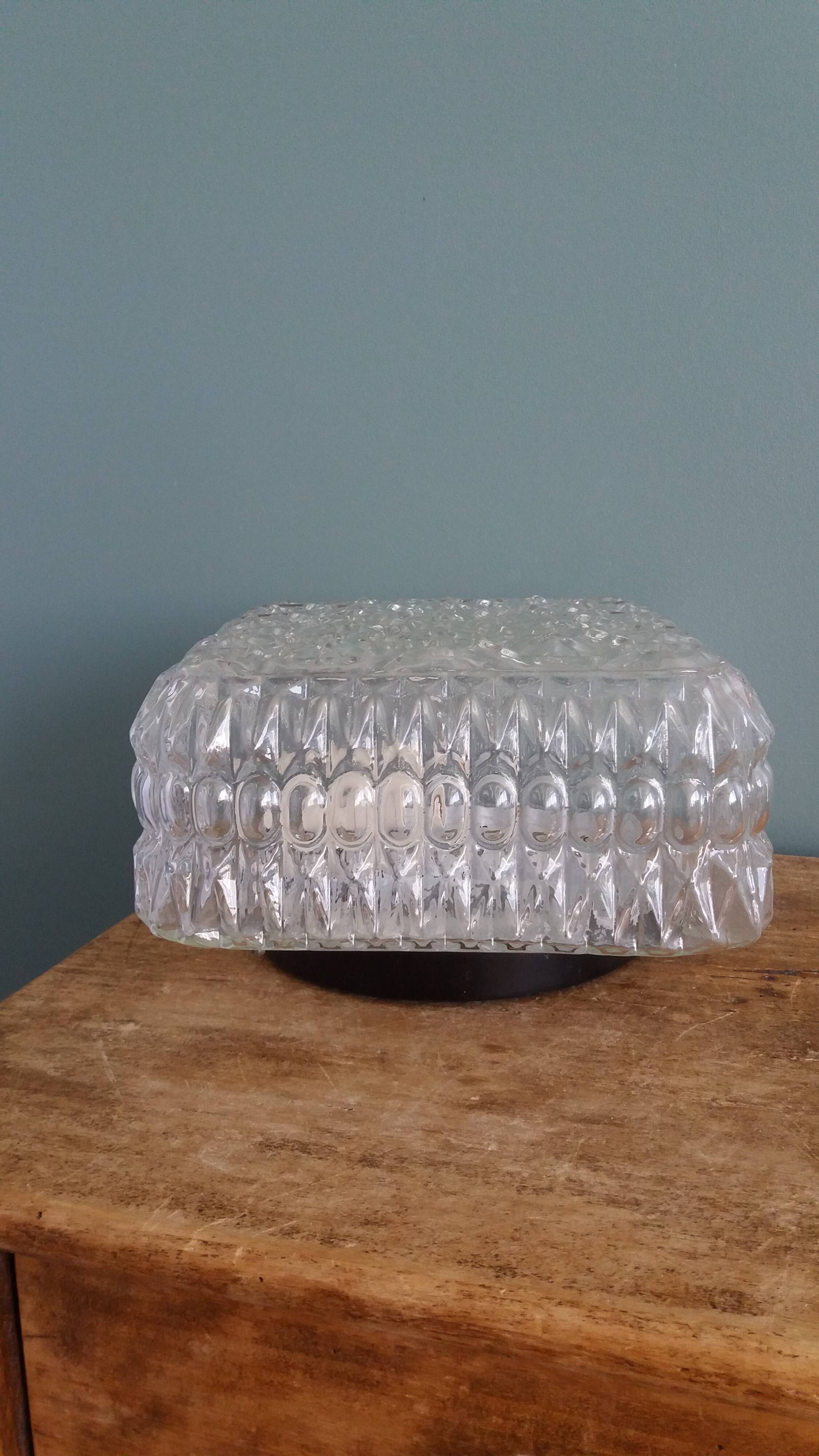 Square globe ceiling light in moulded glass.