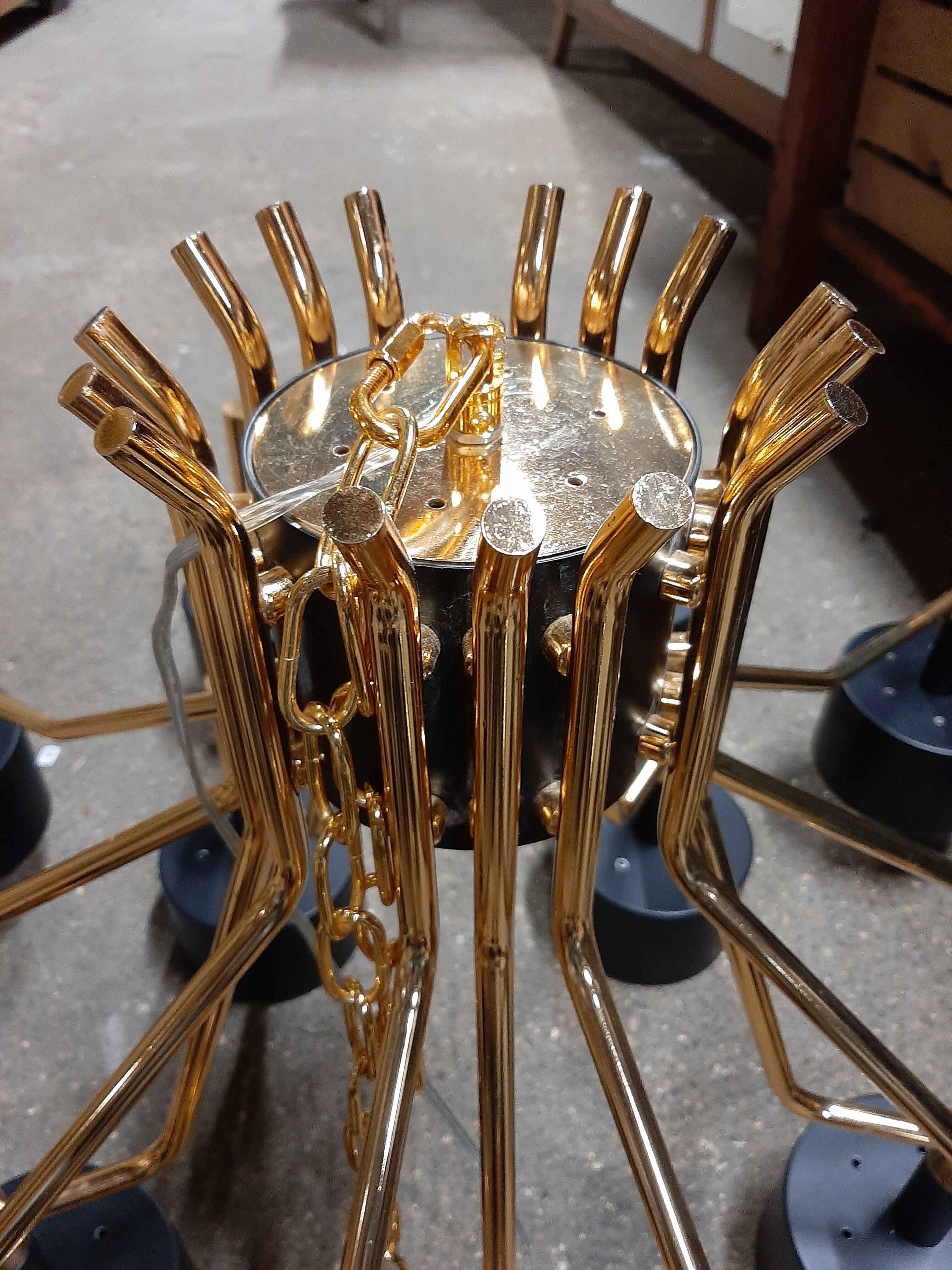 Black chandelier and gilded metal