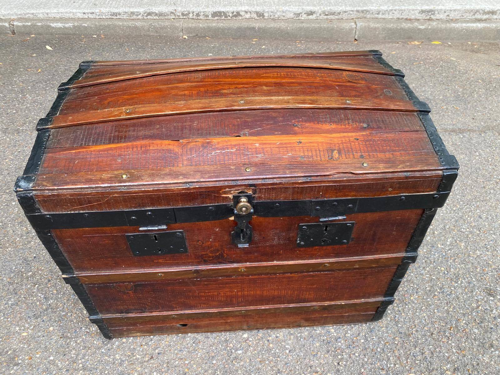 Vintage domed travel trunk from the 19th century.