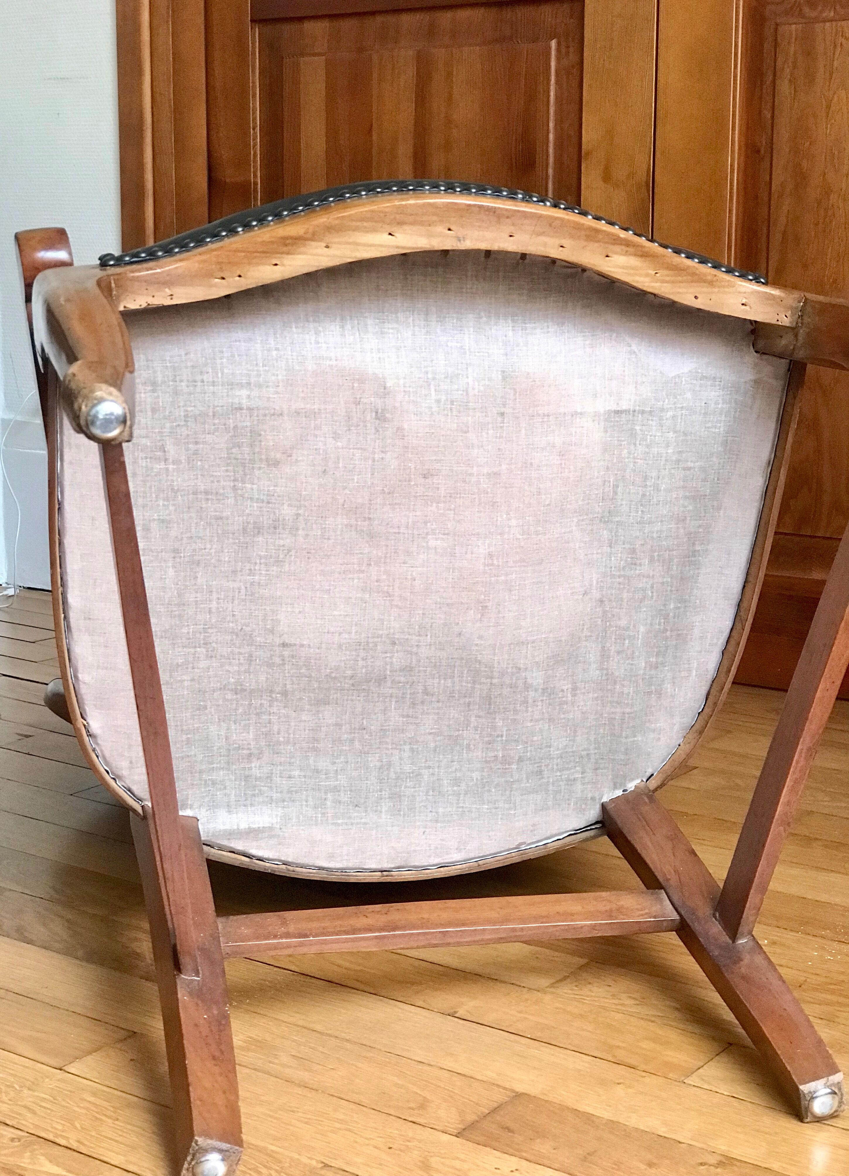 Wood and leather armchair
