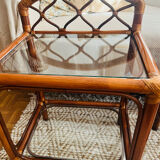 Two rattan and glass bedside tables