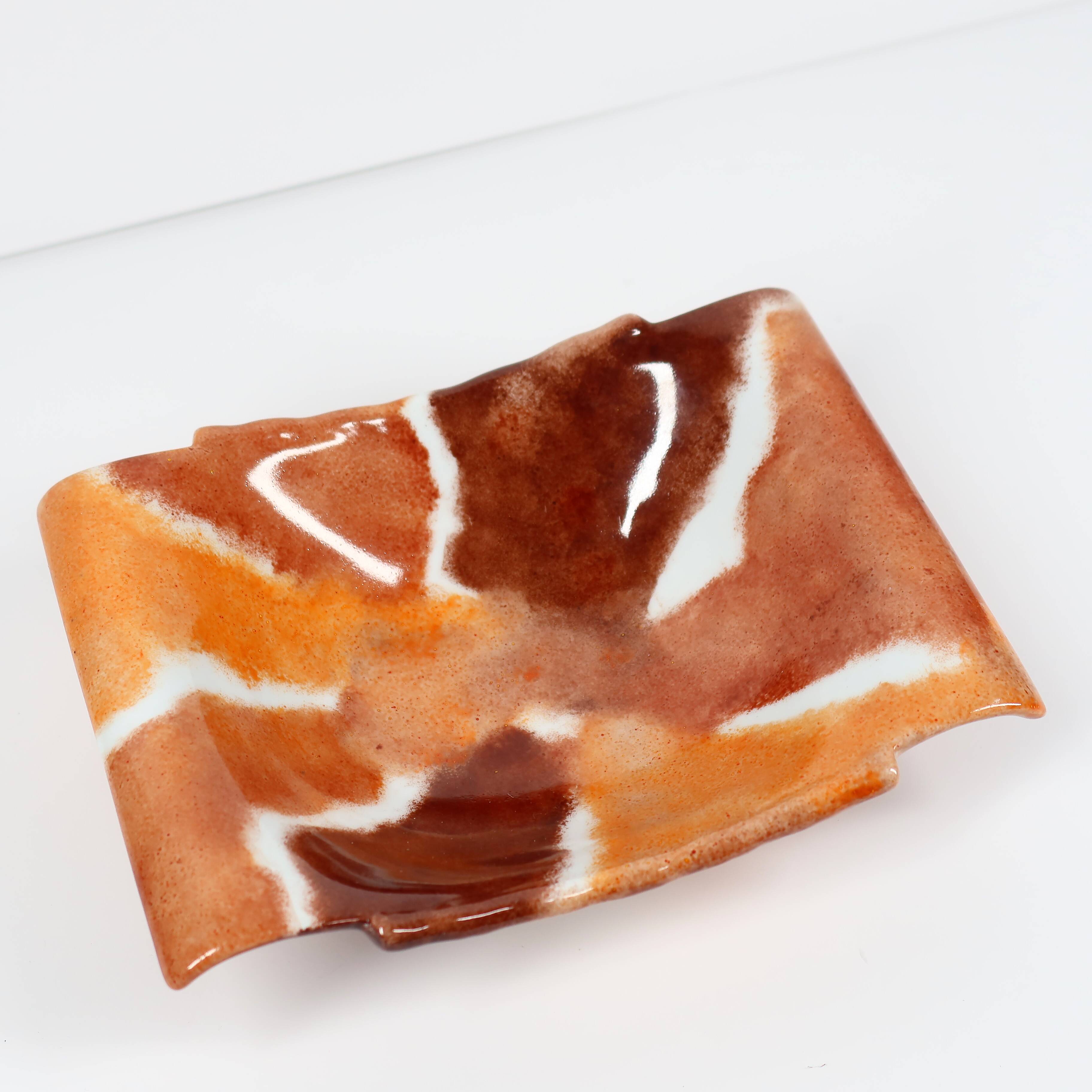 Handcrafted ceramic trinket dish in shades of brown and orange