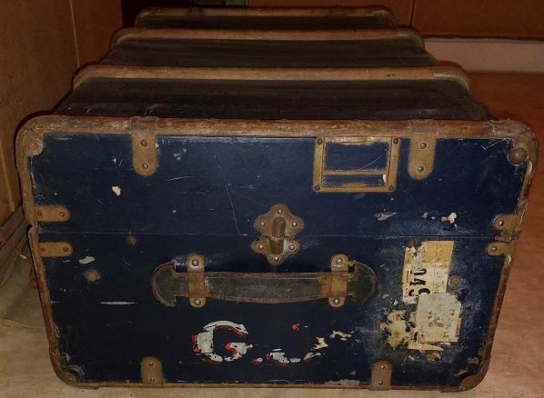 Old black wooden trunk with reinforcements