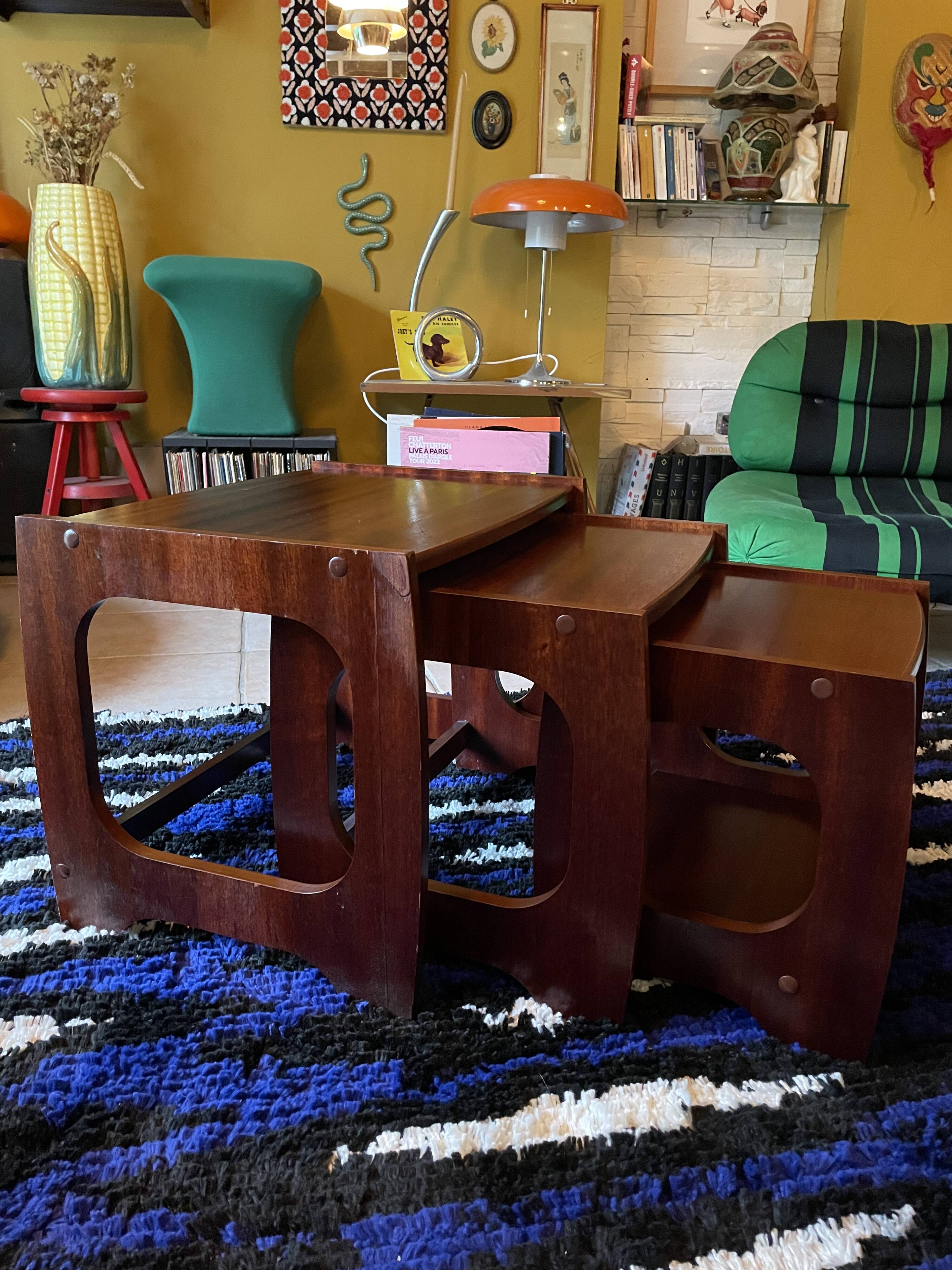 Set of three nesting coffee tables, 1970, dark wood.