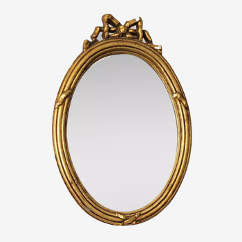 Oval mirror in gilded wood, 31x21 cm