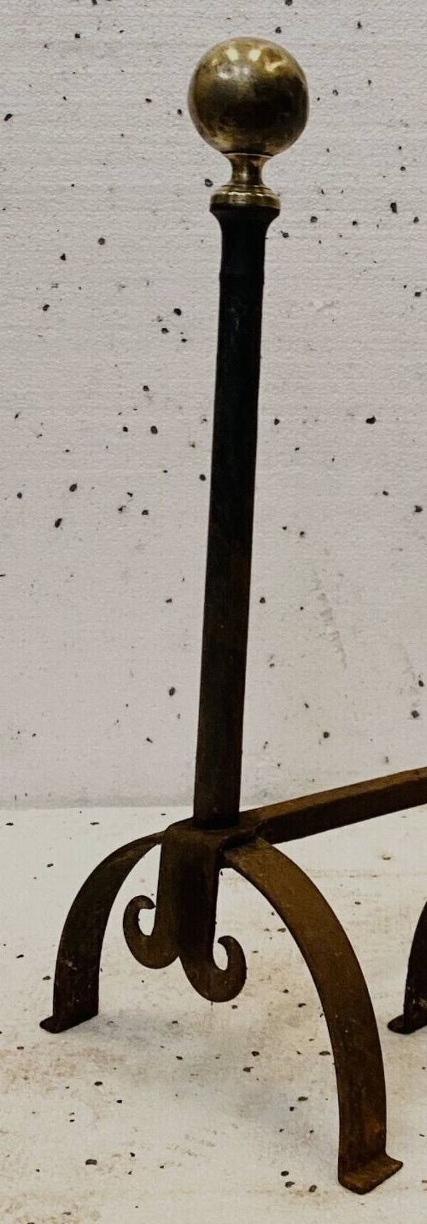 Paire de chenets porte buches en fer forgé XX siècle