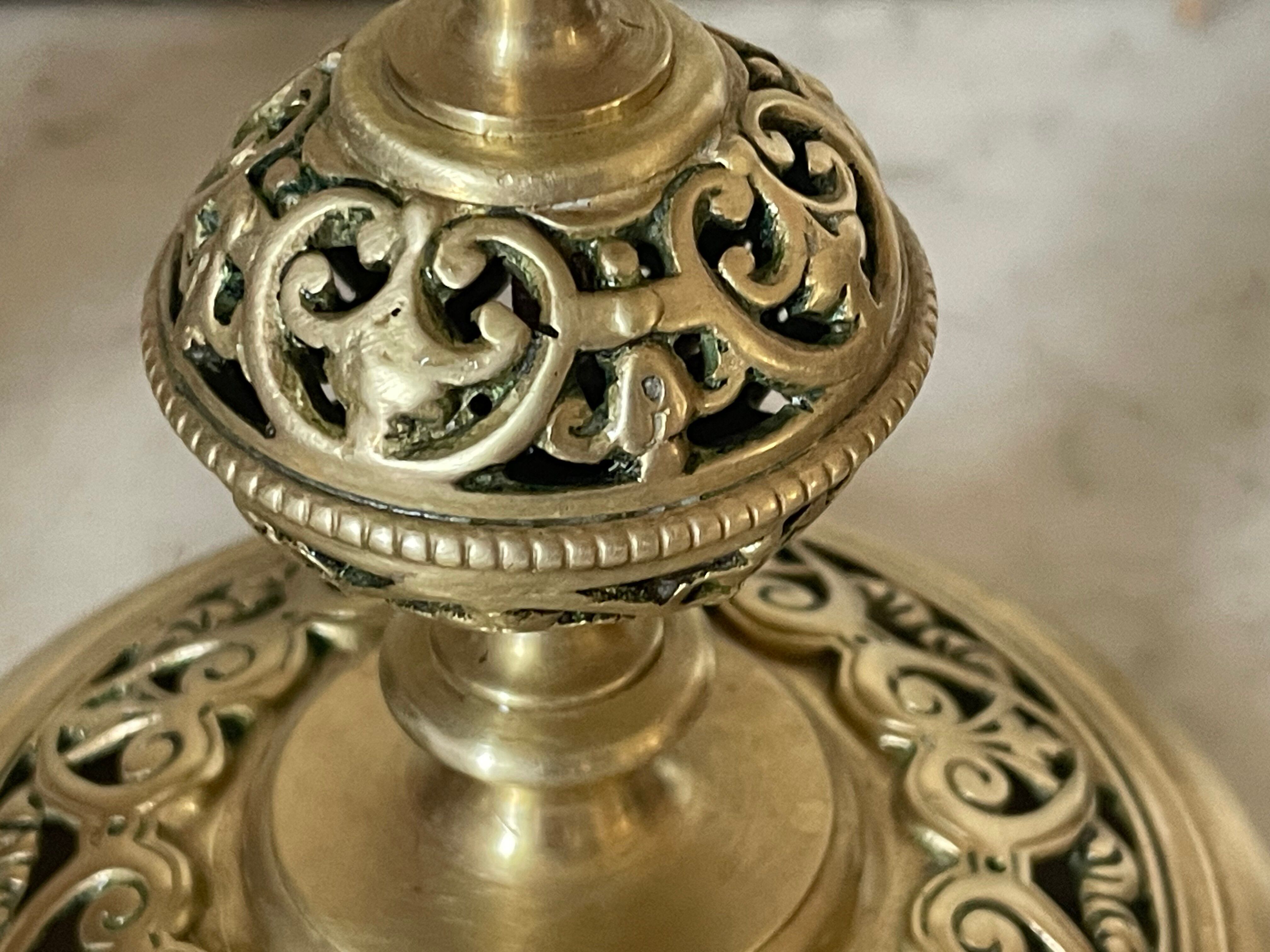 pair of openwork gilded brass candlesticks from the 19th century