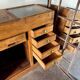 Counter, glass-fronted wooden workbench in dark wood, 8 drawers.