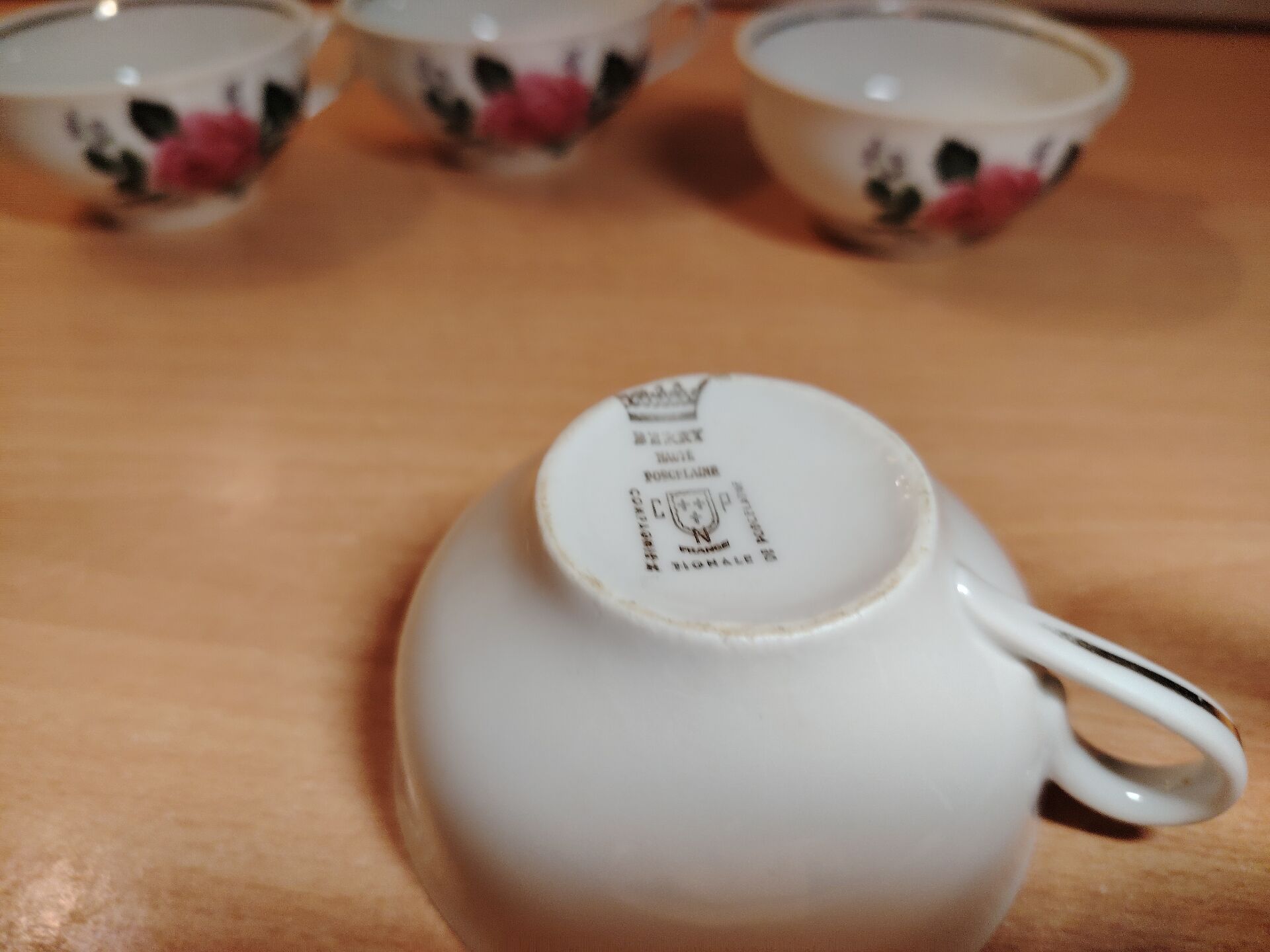 Set of 4 antique porcelain cups with rose pattern CNP France