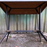 Vintage bistro table with an Art Deco style cast iron base and Formica top.