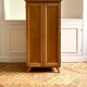 Small oak cabinet with tapered legs.