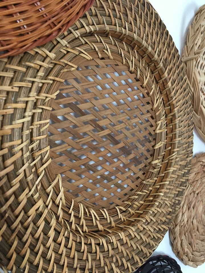 Wall composition of seven baskets and wicker trays