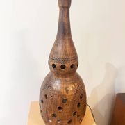 Terracotta lamp with cut-outs, circa 1970.