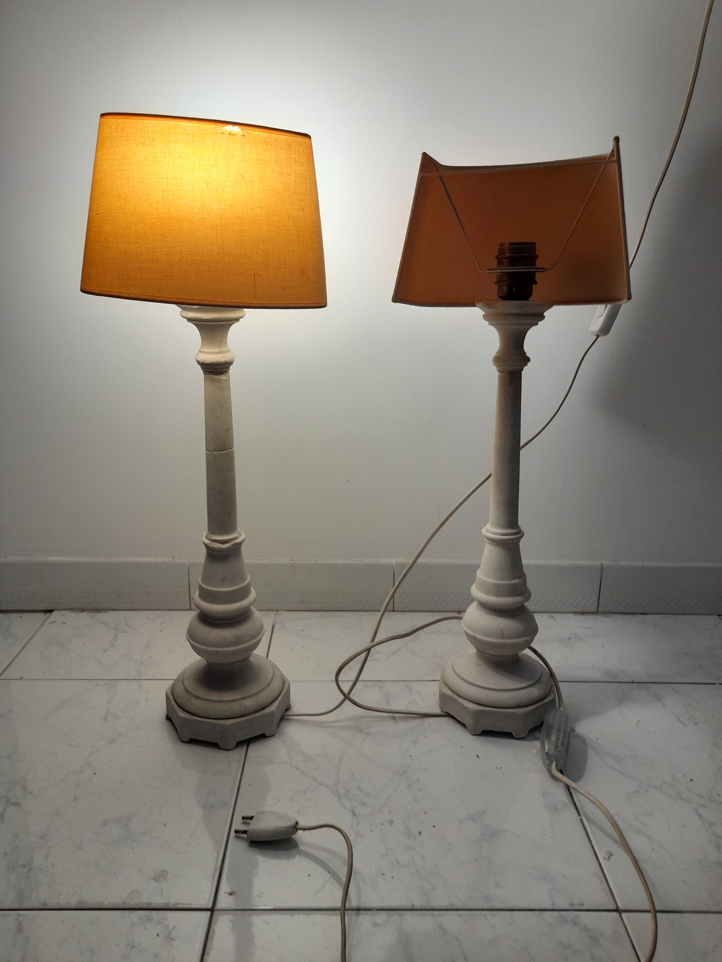 A pair of antique desk lamps with white marble bases