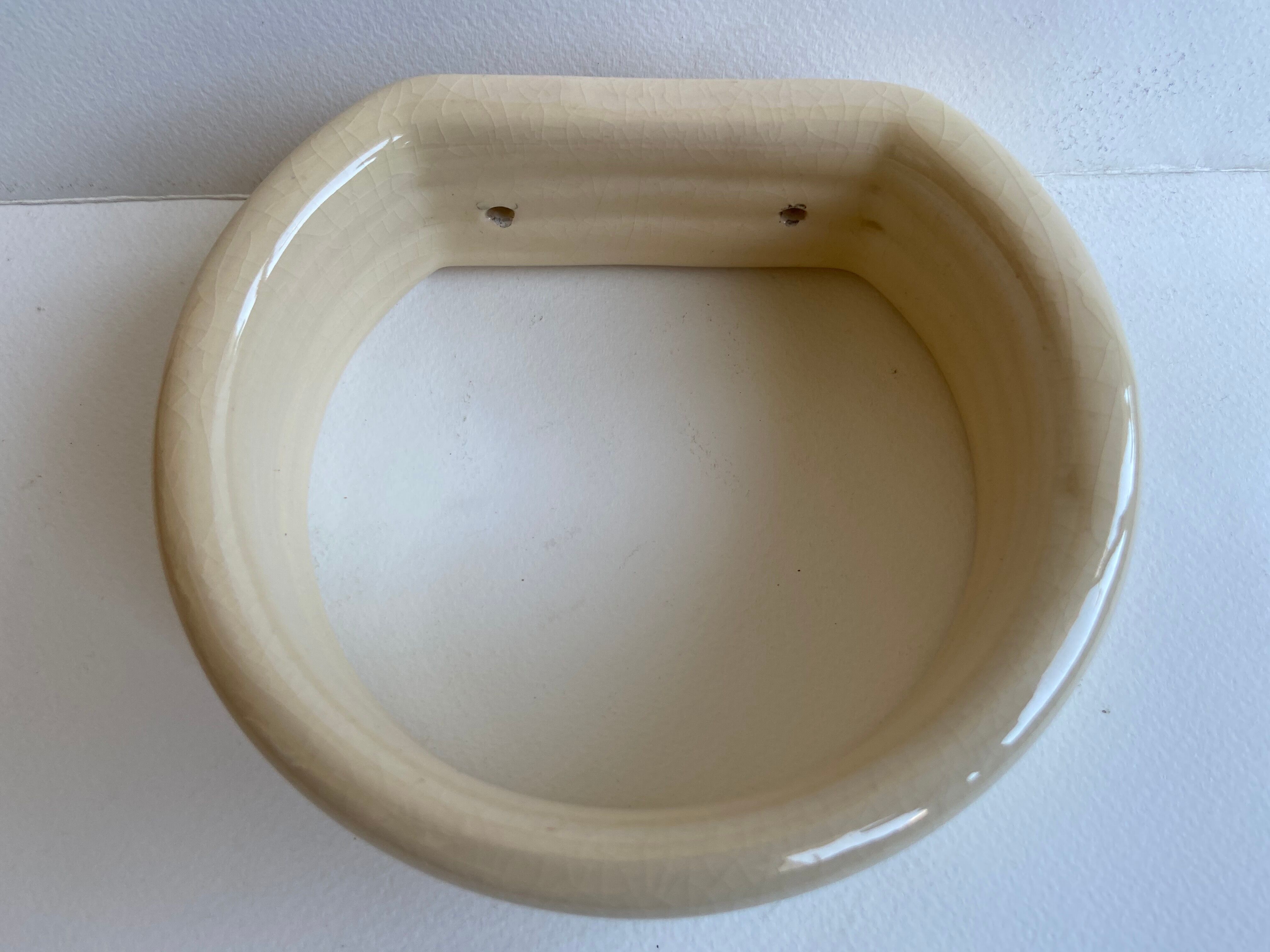 Enamelled ceramic wall pad