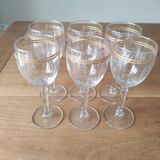 Set of 6 glasses with gold band decorations.