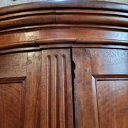 Antique demi-lune cabinet in walnut, late 18th century, French château.