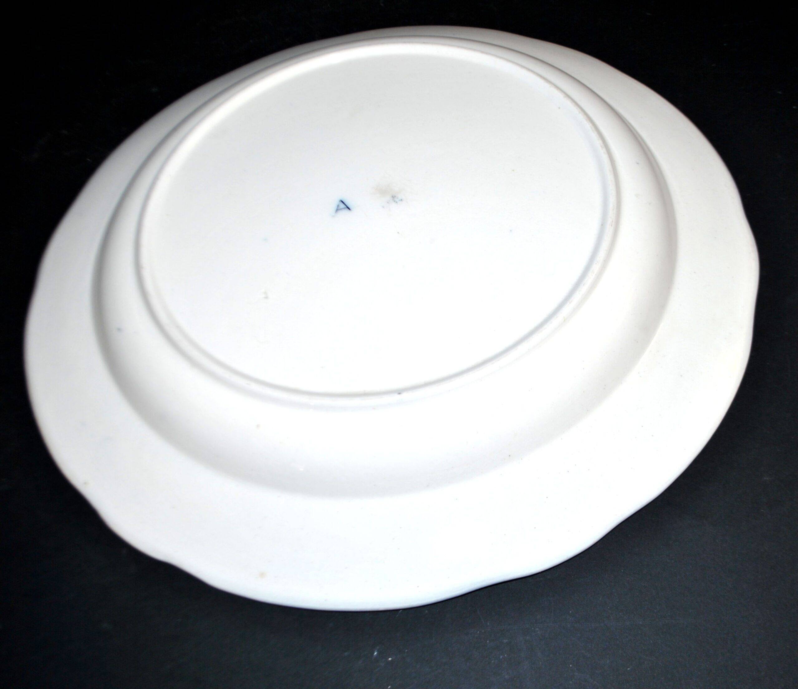 Large round antique plate with monochrome blue and black floral decoration, circa 1850.