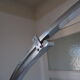 Lampadaire arc Guzzini alu chrome travertin