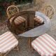 dining table and chairs made of curved bamboo and rattan with smoked glass from the 1970s