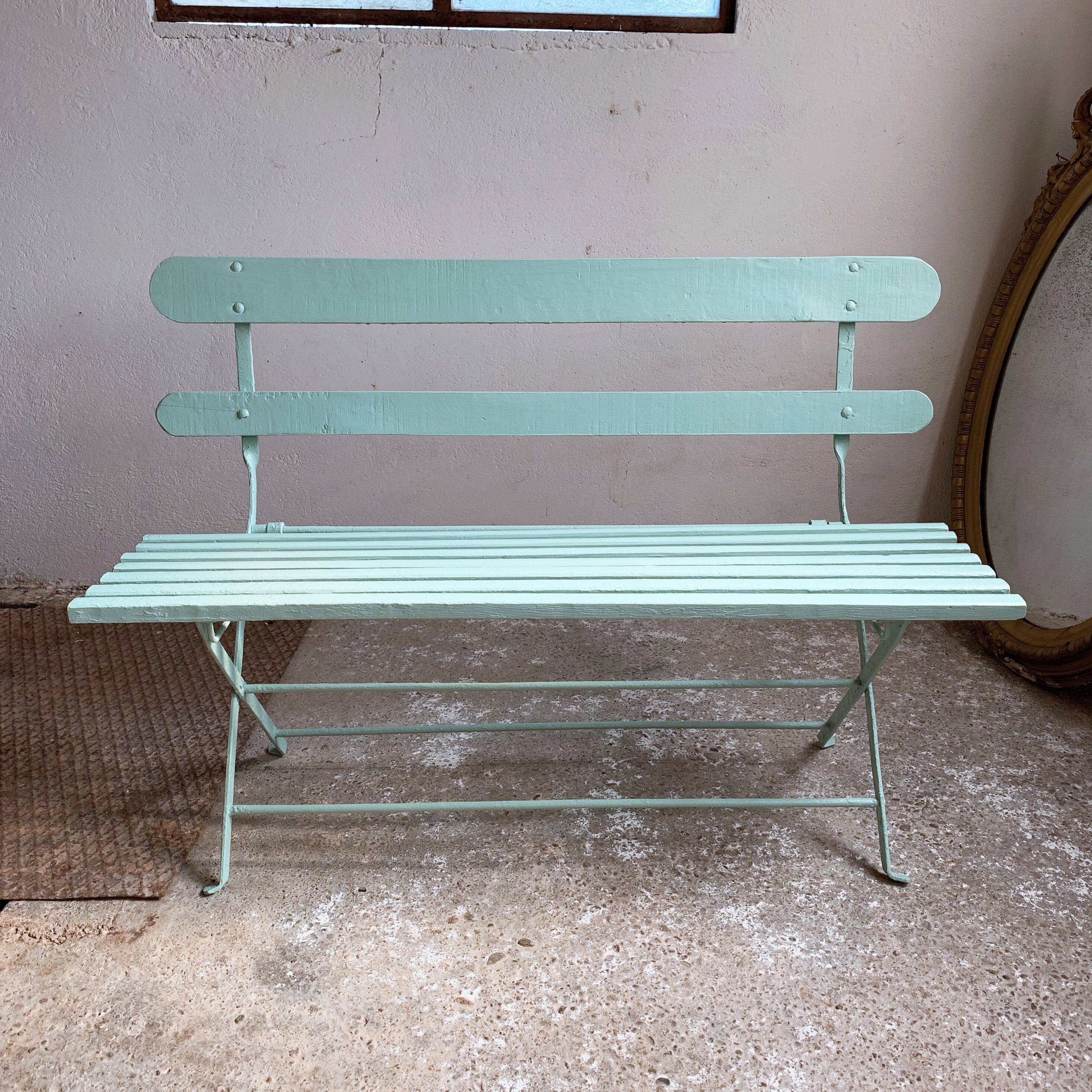 Former folding garden bench with wooden and metal slats