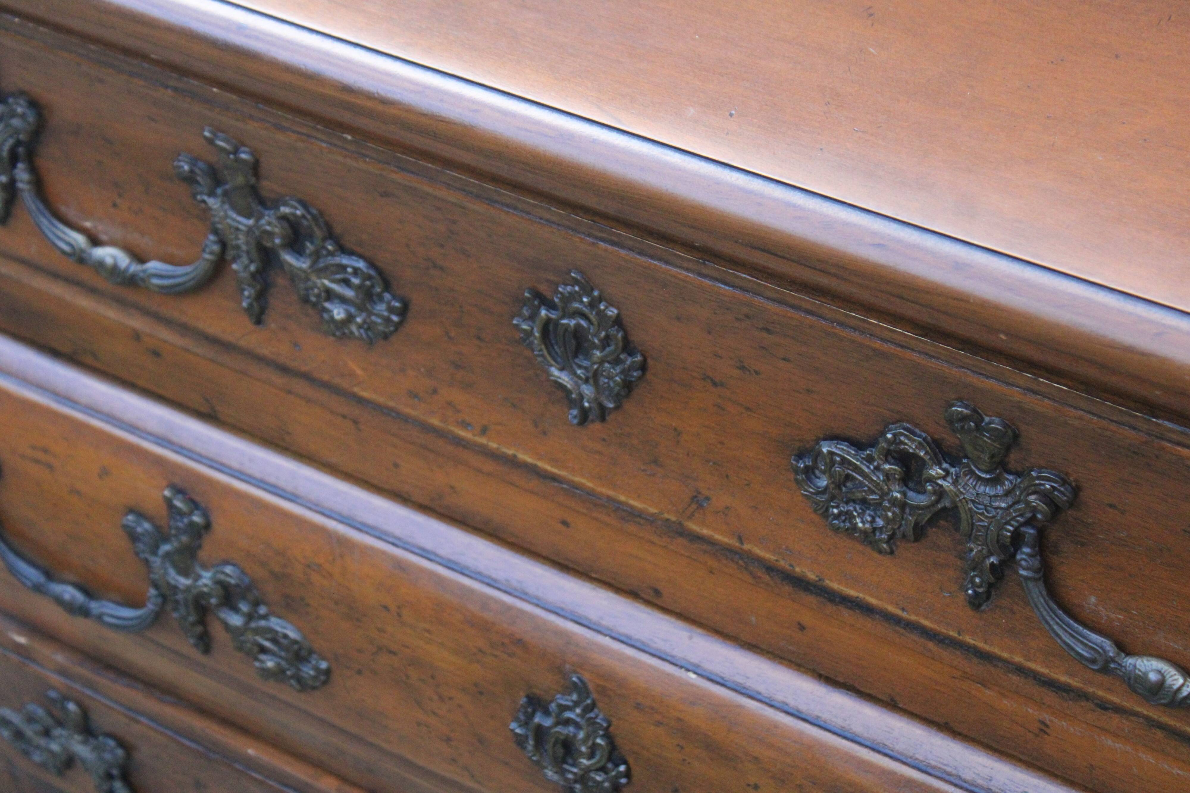 Curved Louis XV style chest of drawers known as a “tomb”