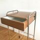 Serving bedside in gold metal and formica