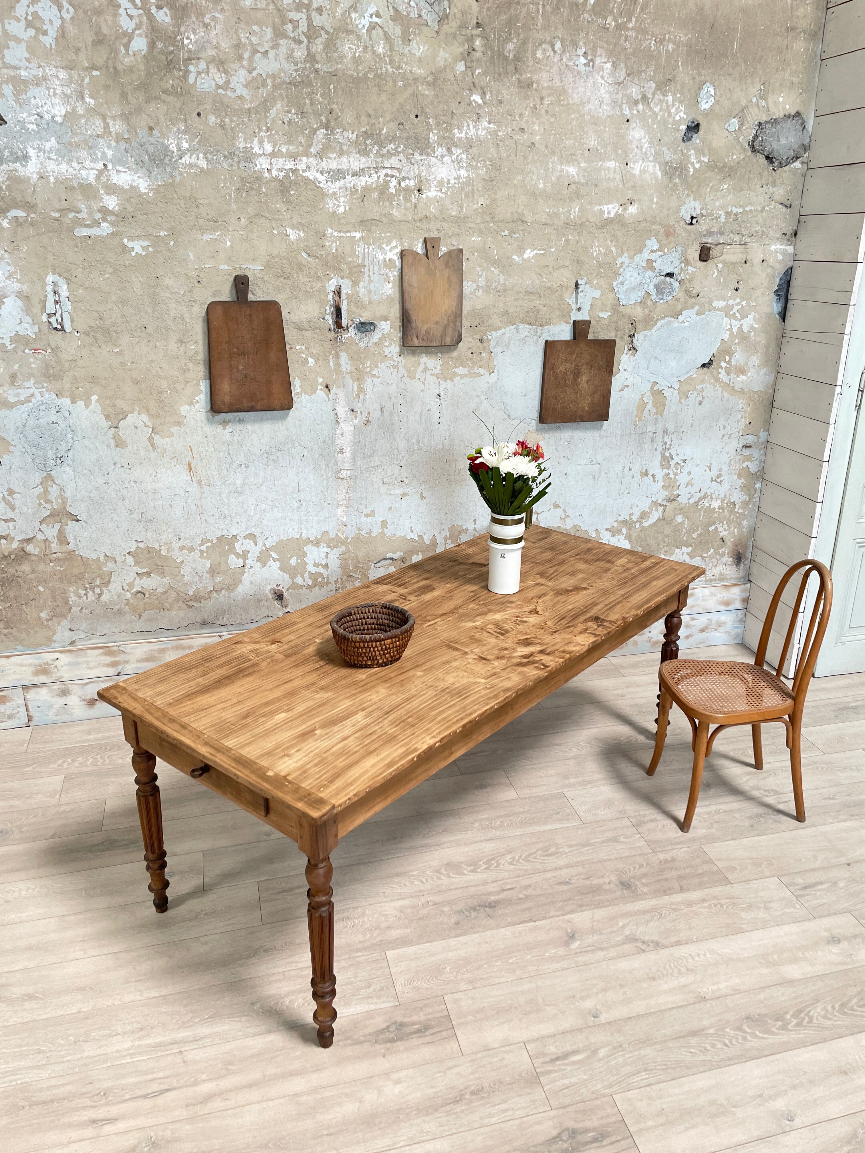 Vintage farmhouse table with turned legs.