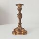 Antique 19th-century solid gilded bronze candlestick in the Louis XV style.