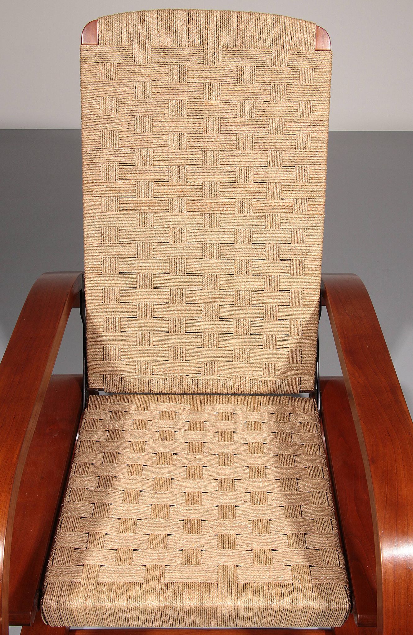 An exceptionally rare mahogany recliner crafted in Italy during the 1950s"