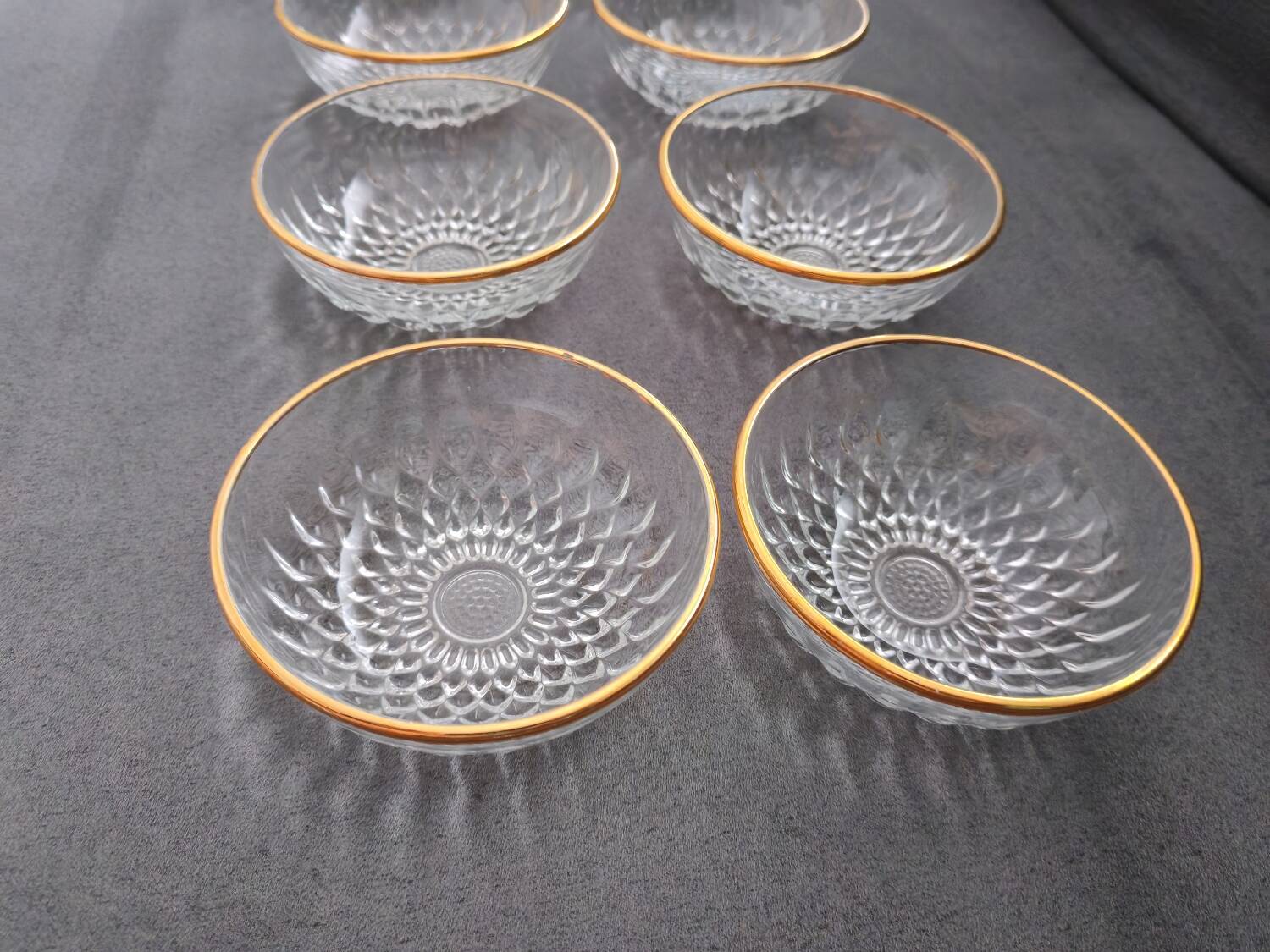 8 glass bowls with gold rim