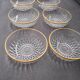 8 glass bowls with gold rim