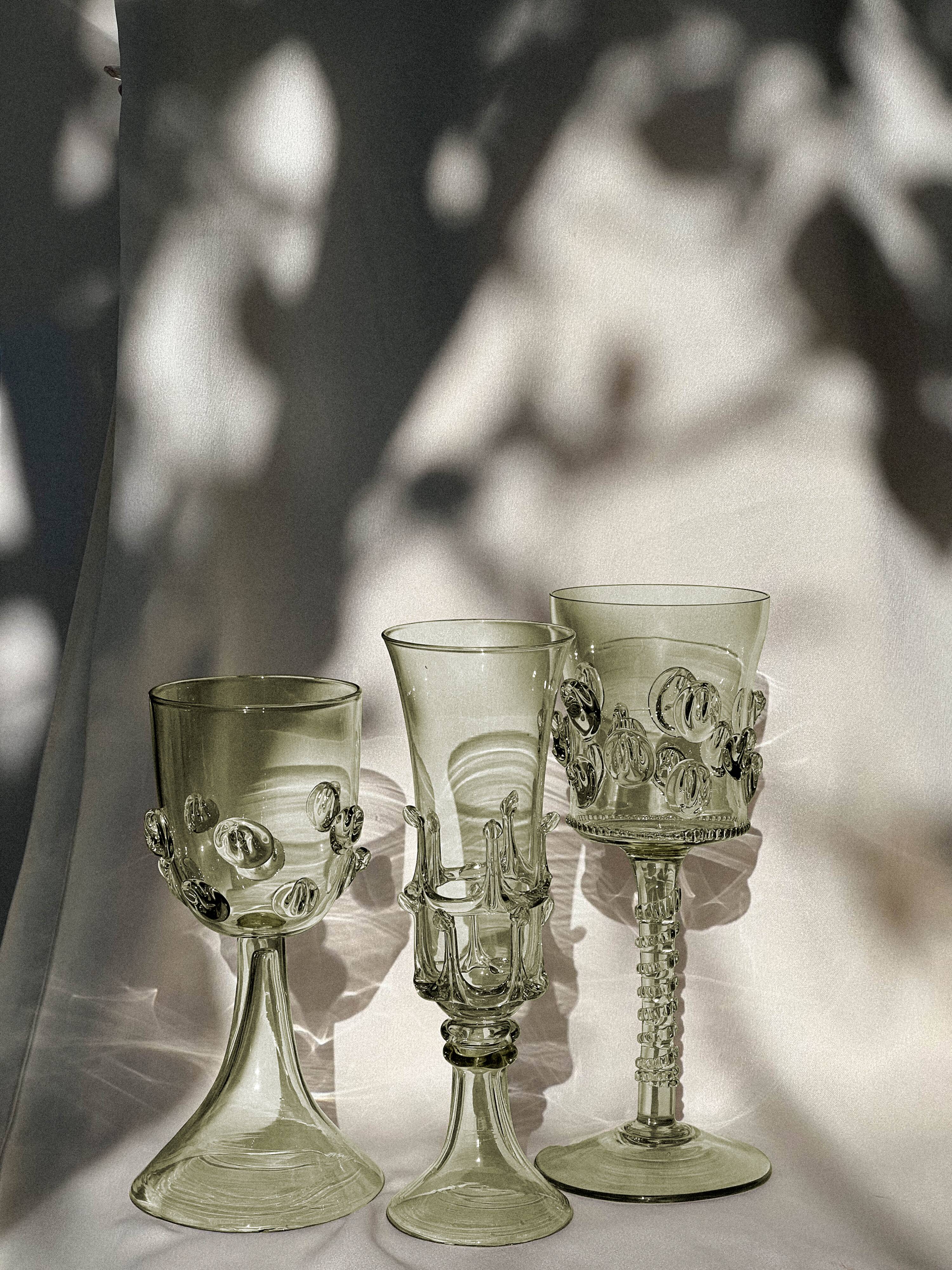 pair of green glass champagne flutes - label