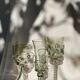 pair of green glass champagne flutes - label