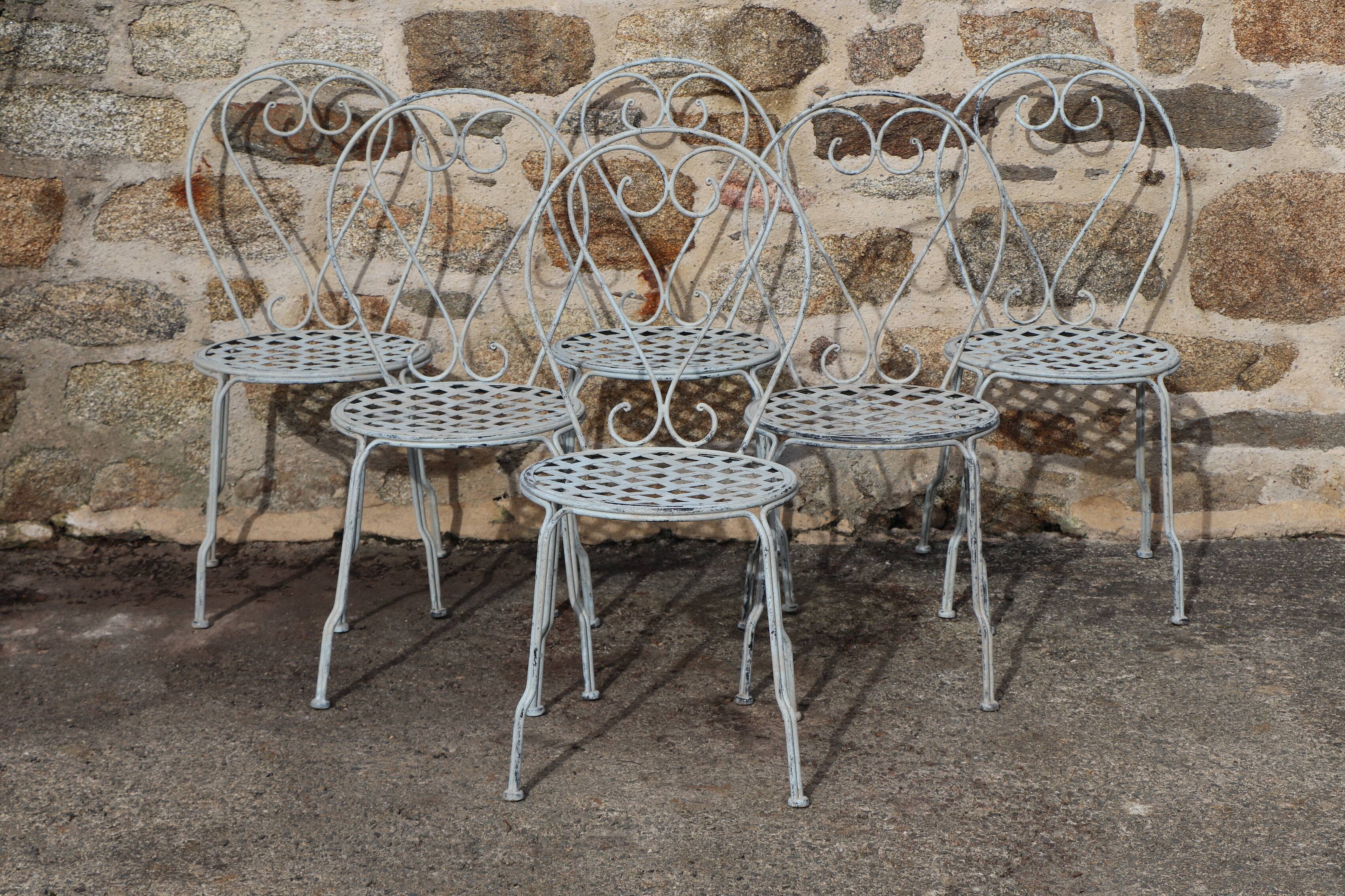 Series of 6 wrought iron garden chairs