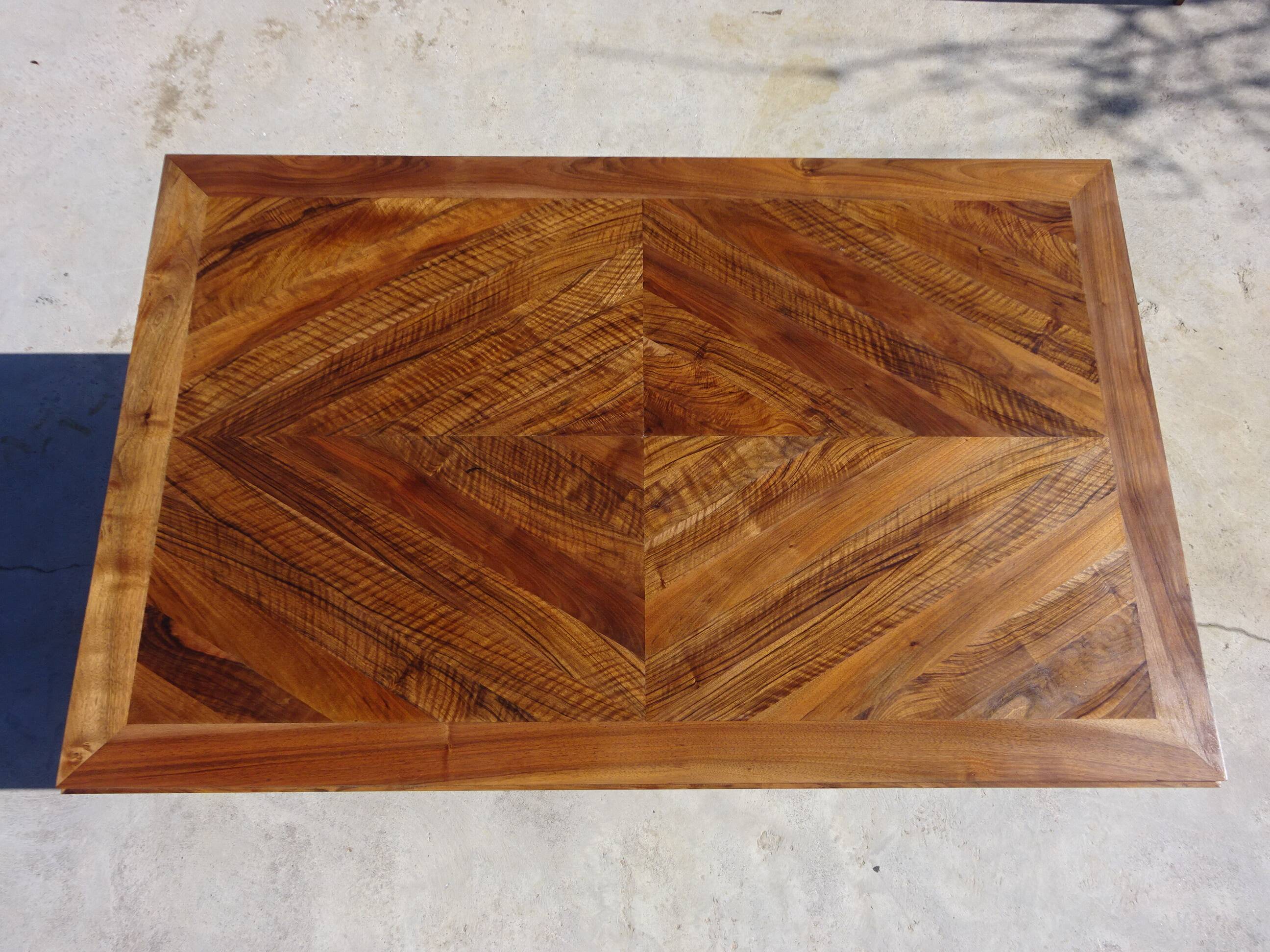Antique solid walnut table with marquetry and extensions.