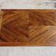 Antique solid walnut table with marquetry and extensions.