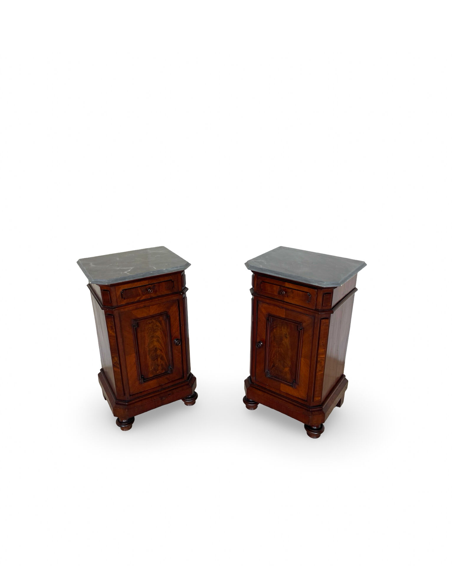 A pair of antique walnut bedside tables from the 1890s.