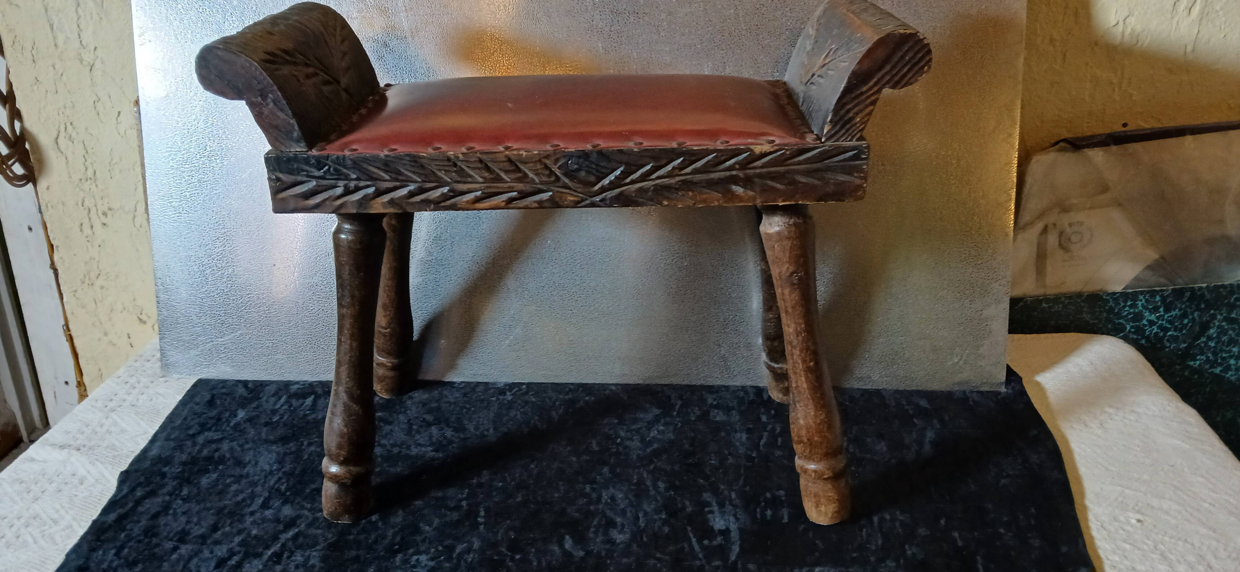 Carved wood and faux leather bench or vintage spanish ottoman footstool
