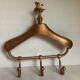 Coat rack gilded metal hanger varnished