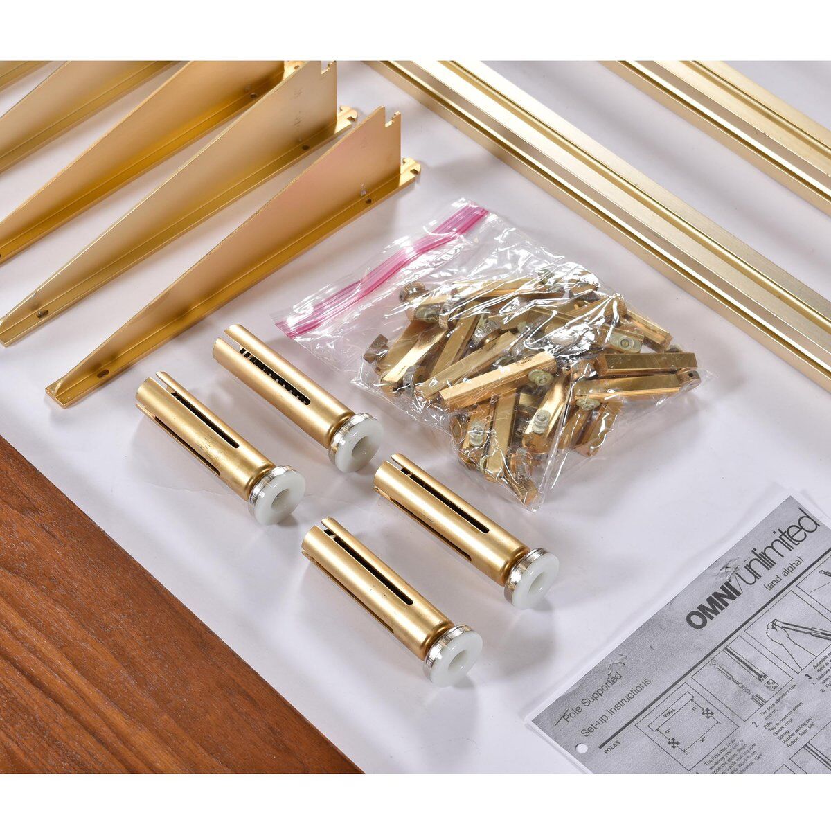 Tension pole free standing rose gold aluminum Omni wall unit by George Nelson