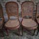 Set of 6 antique Louis XVI style dining chairs with caning.