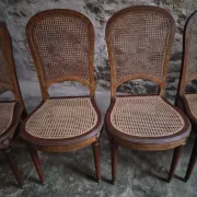 Set of 6 antique Louis XVI style dining chairs with caning.
