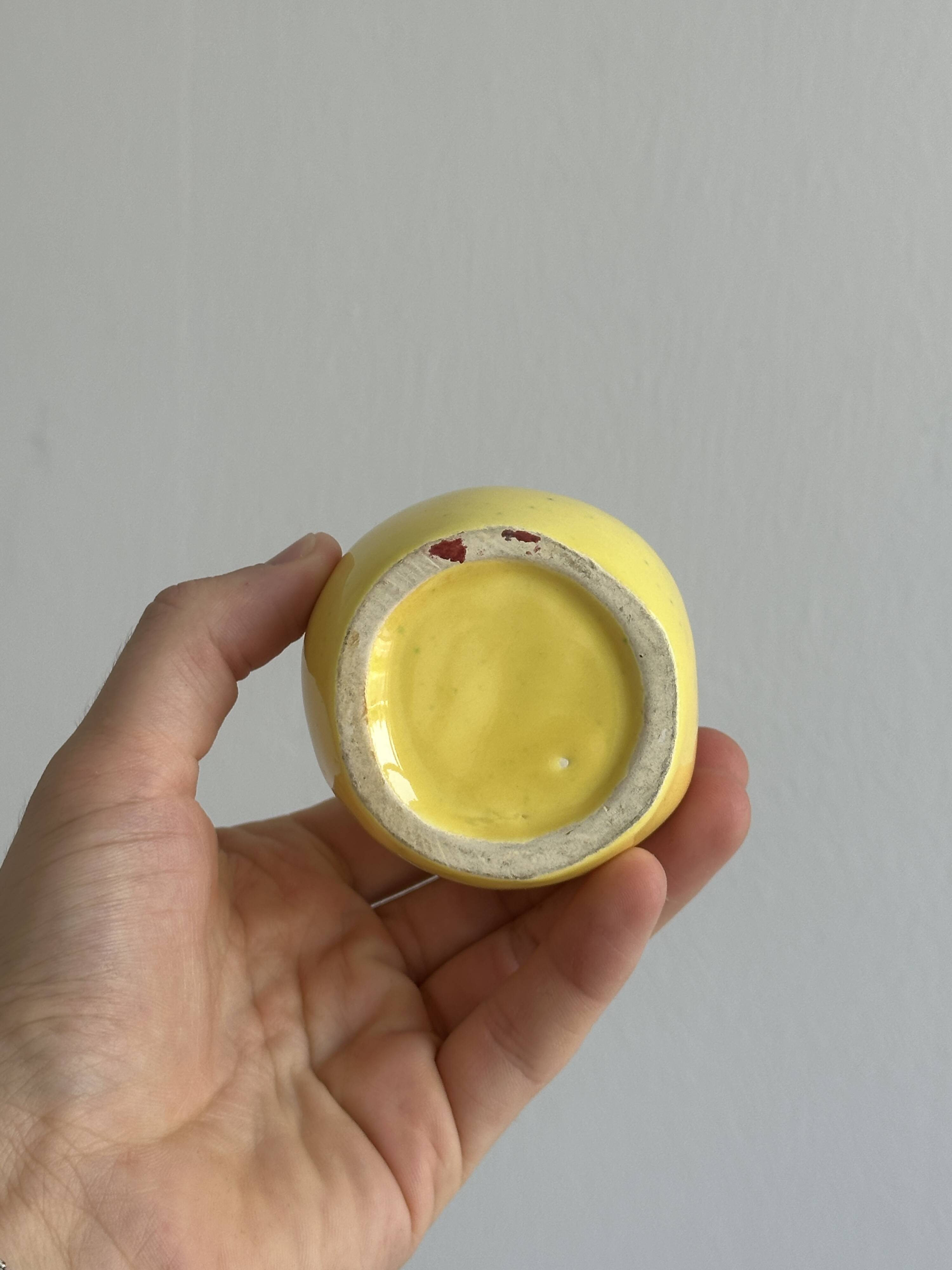 Yellow ceramic pear-shaped salt shaker