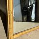 Miroir doré style Restauration à décor de palmettes étirées