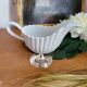 Porcelain and silver-plated gravy boat