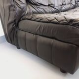 Vintage corner sofa composed of 3 modules in black leather with integrated bed.