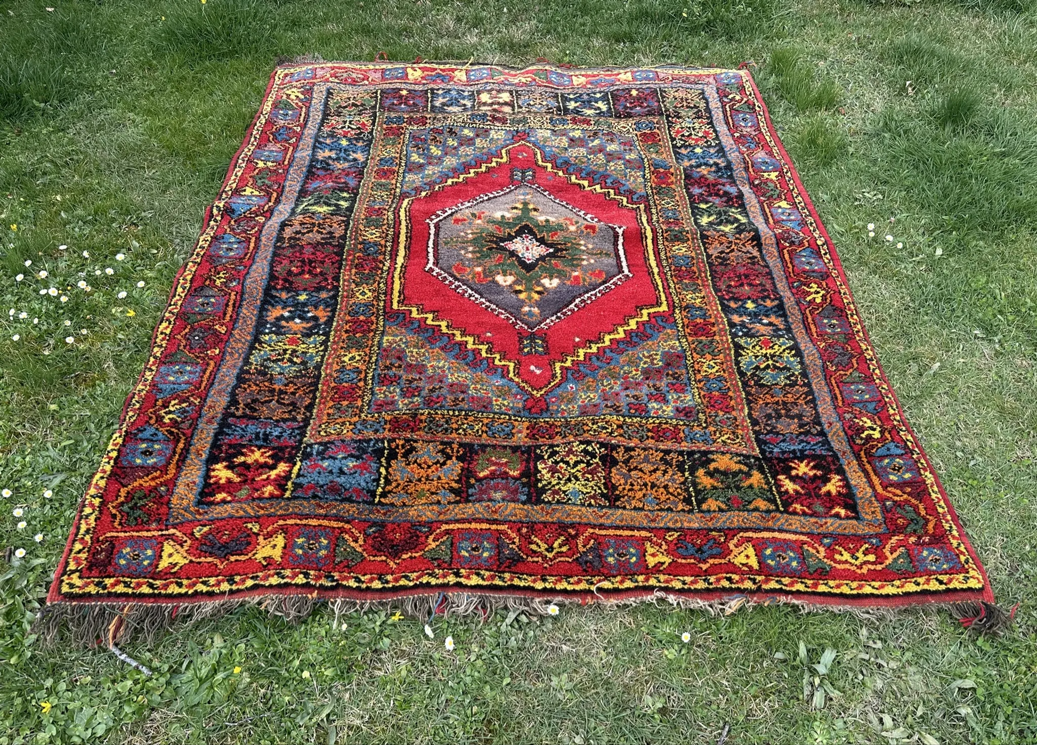 Old Moroccan carpet, made of natural wool and handwoven.